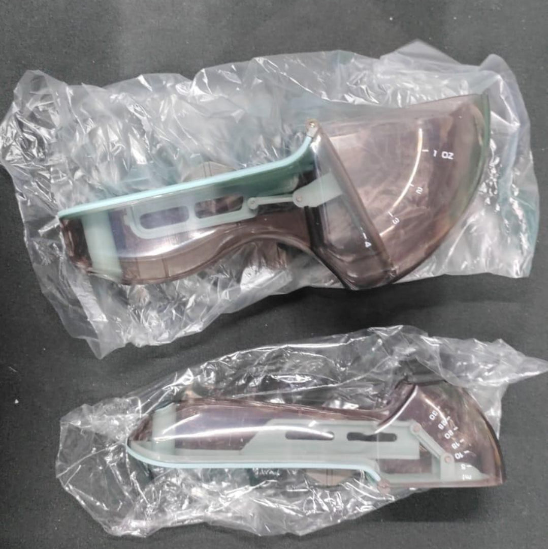 Two measuring spoons with adustable markings