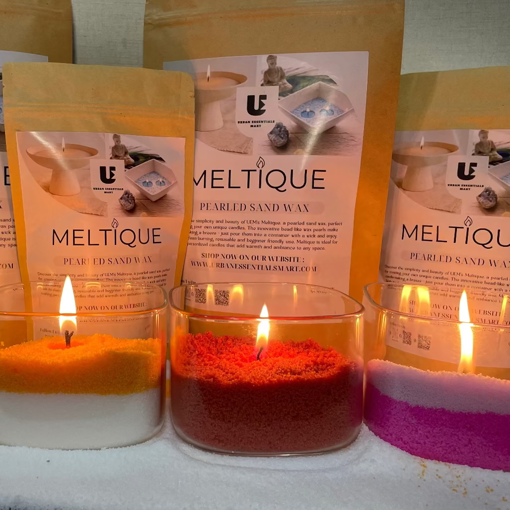 Meltlique candles with packaging on a snowy surface
